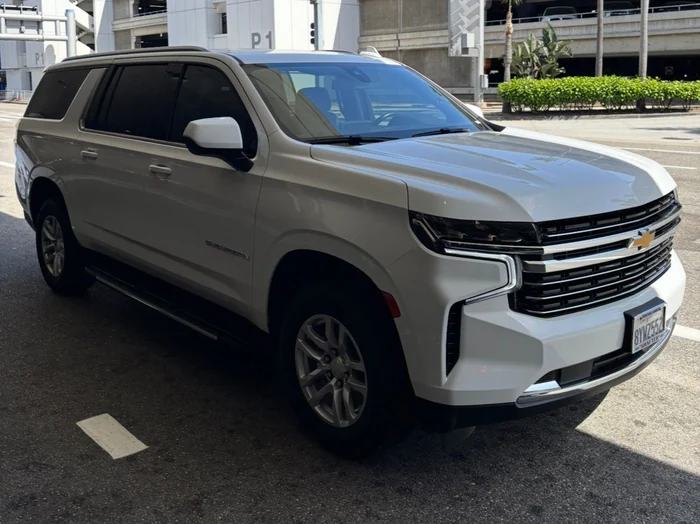 White luxury SUV at the LAX parking structure, ready for an airport pickup